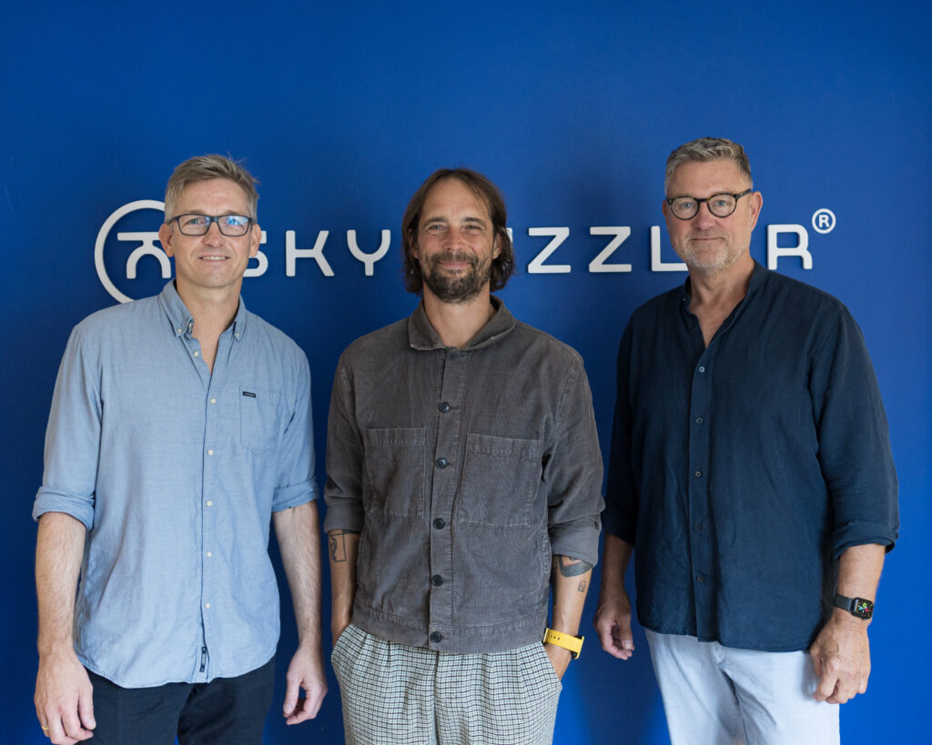 Three males standing next to each other